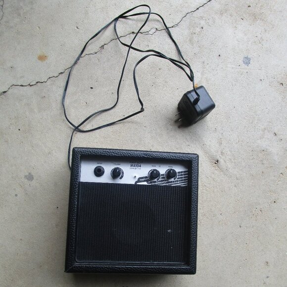 First Act's compact guitar practice amplifier sports a cool, rugged, retro desig - Picture 1 of 3